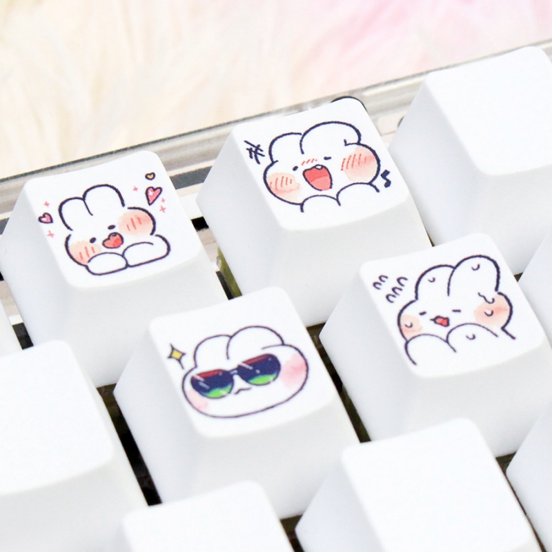 four keycaps with rabbits patterns
