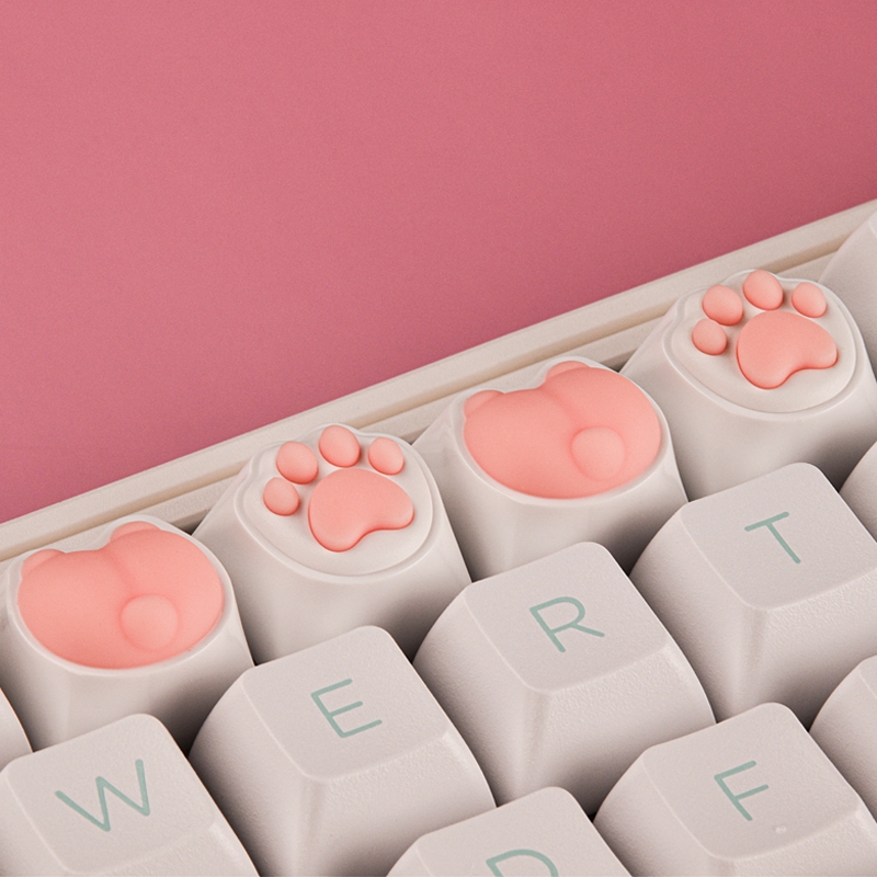 four pink keycaps